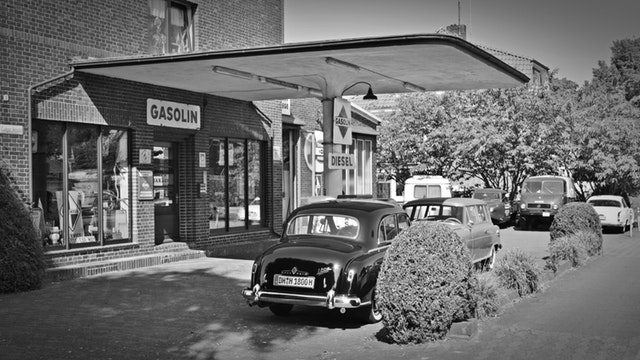 old cars at petrol station