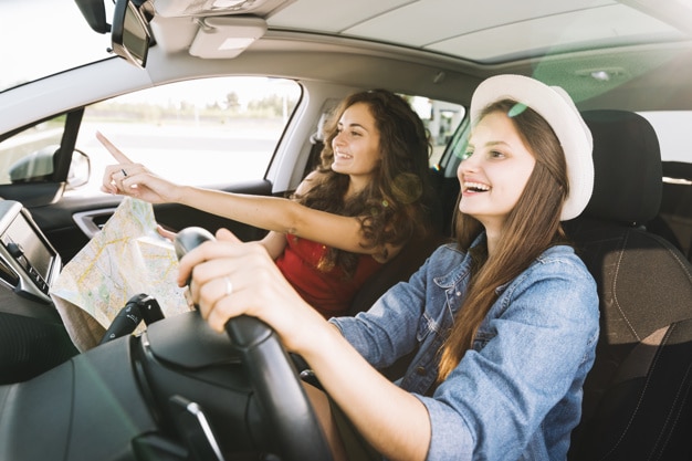 cheerful-women-driving-car